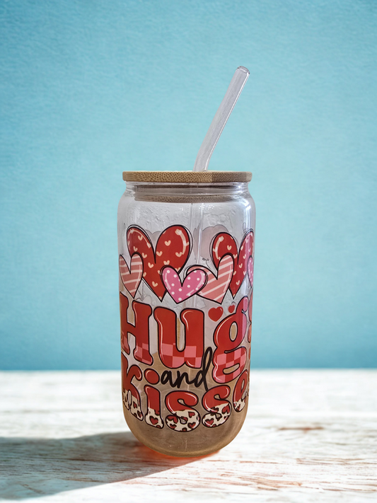 Tumbler with heart designs and text on a light blue background